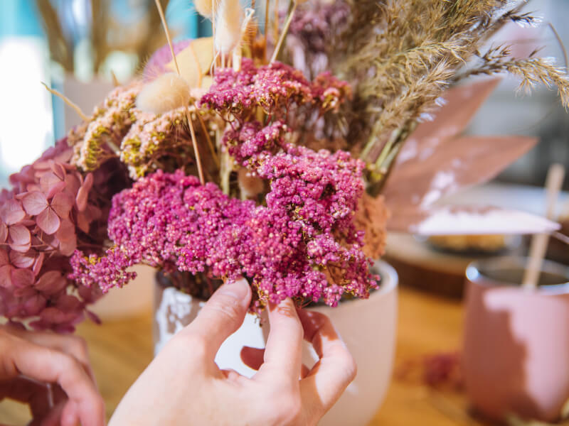 A dried bouquet in a vase.